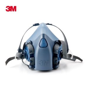 3M 7502 professional half-face respirator made of light blue silicone, showing the front-mounted Cool Flow valve and the adjustable grey head harness with drop-down capability.