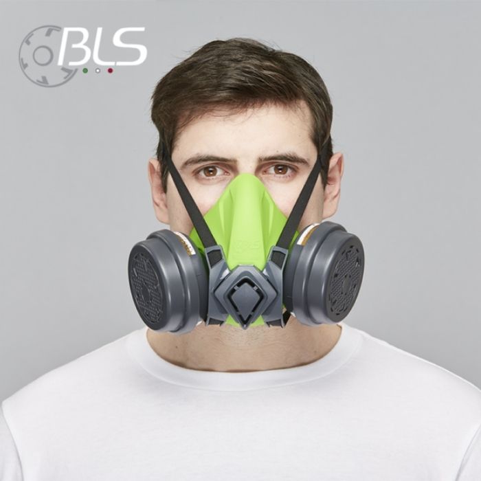 A grey and black BLS 4000 Next R half-face respirator showing the soft TPE face seal, the sliding "Drop-Off" head harness system, and dual bayonet connection points for BLS cartridges.
